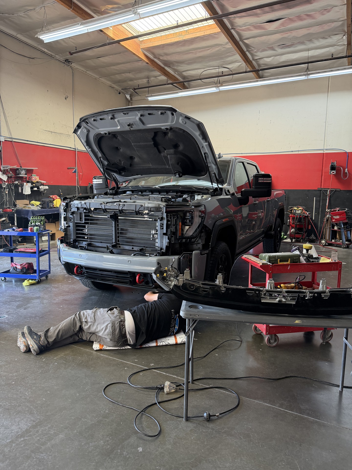 Bravada technician working on a truck during collision repair
